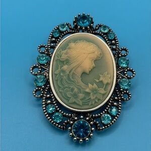 Elegant Blue Cameo Brooch with Silver Tone Filigree and Blue Rhinestones